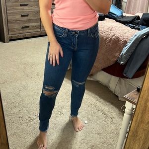 Blue jeans with rips